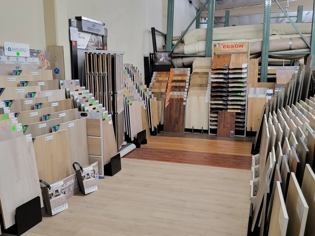 Waterproof laminate and wood-look flooring examples at The Carpet Store showroom