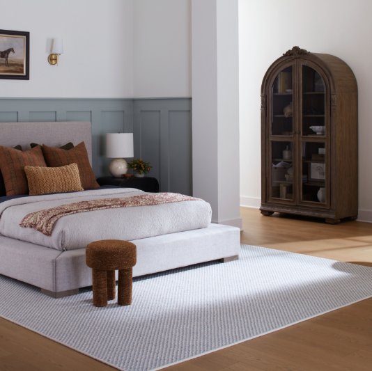 Karastan Belleluxe Flooring with a grey area rug in a stylish bedroom